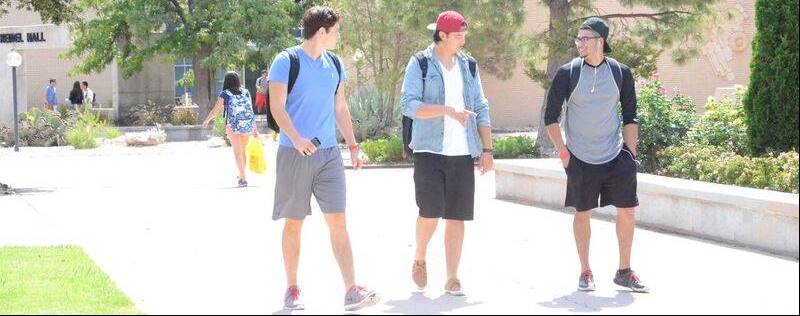 students walking on sidewalk